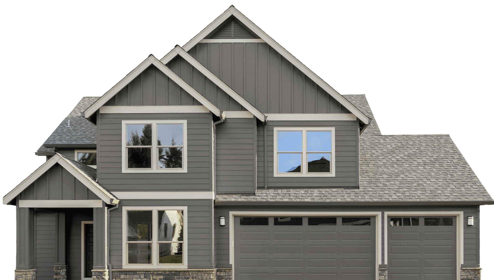 Two-story modern house with gray siding, multiple peaked roofs, large windows, and a double garage.